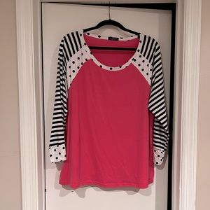 Hot pink and polka dot shirt.